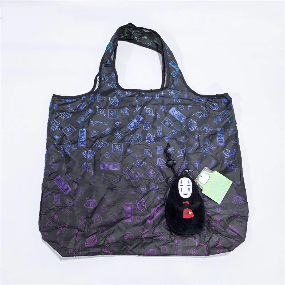 A black fabric bag featuring a pattern of blue and purple geometric shapes, with a small black hippo plush toy inside.