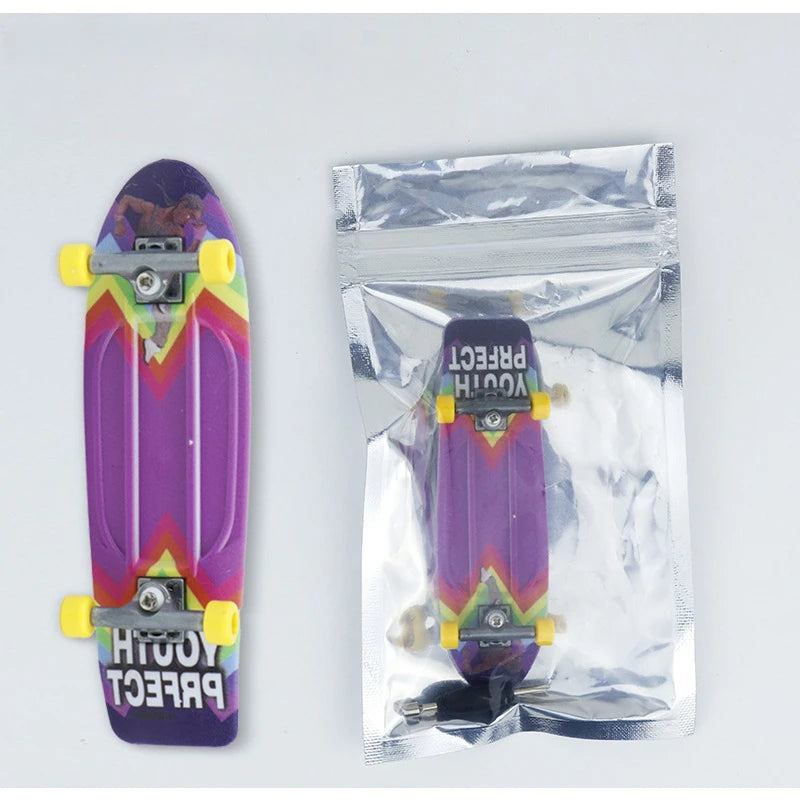 A purple finger skateboard is shown next to its clear plastic packaging.