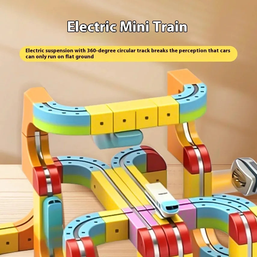 A colorful electric mini train set featuring flexible magnetic track pieces and suspension components.