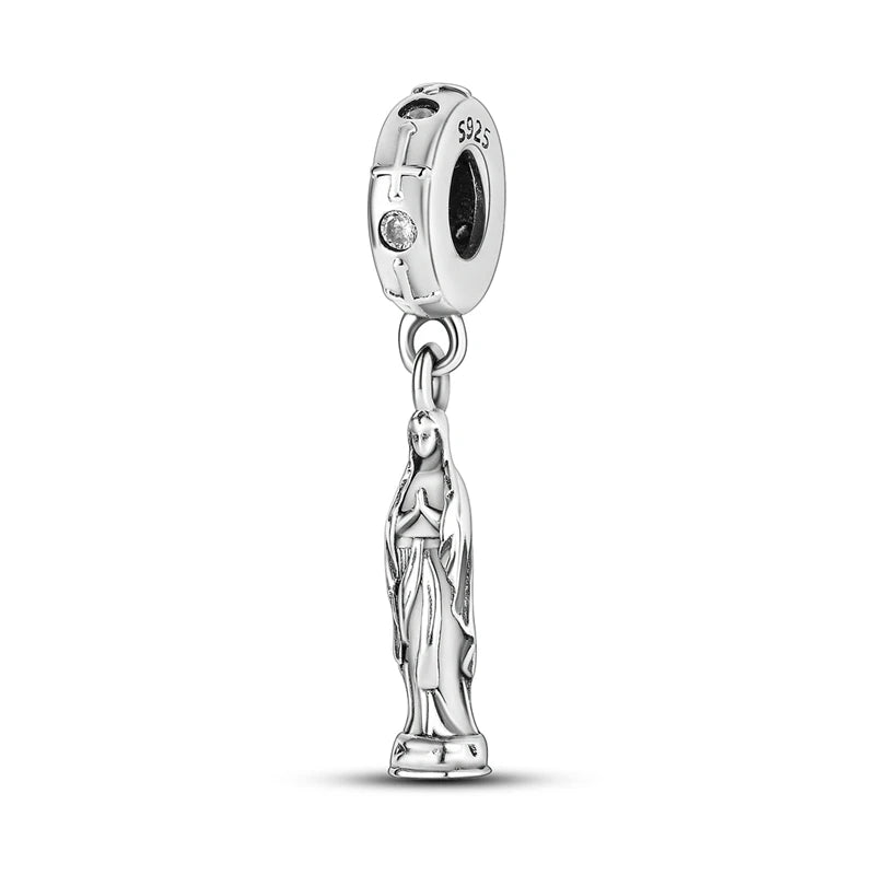 A sterling silver charm bead featuring a cross and a figure of Mary, designed for DIY bracelet making.