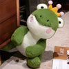 A soft, cuddly plush toy of a green frog prince with white and pink accents.
