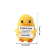 A yellow crochet duck doll with black eyes and an inspirational message tag.