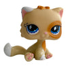 A charming bobble head pet figurine of an orange and white cat with large blue eyes.