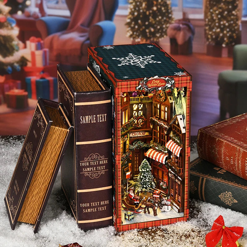 A wooden book nook kit featuring a Christmas street corner miniature model displayed next to its packaging and books.