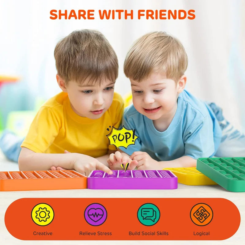Two young boys playing with colorful pop bubble sensory fidget toys for creative and logical development.