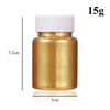 A small amber glass jar with a white cap containing 15g of mica pearl powder for crafting.