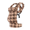 A brown patterned adjustable cotton baby carrier wrap for newborns and toddlers.