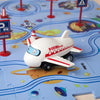 A white and red Boeing flight toy car is placed on a blue plastic railroad track board.
