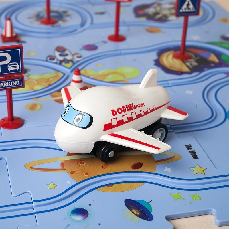 A white and red Boeing flight toy car is placed on a blue plastic railroad track board.