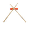 Pair of professional maple wood drumsticks with rubber grips, shown crossed against an orange background.