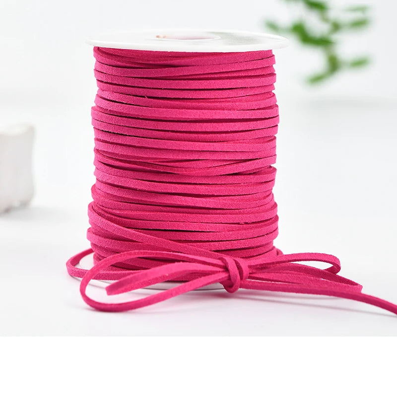 A roll of bright pink velvet faux suede braided ribbon for crafting and gift wrapping.