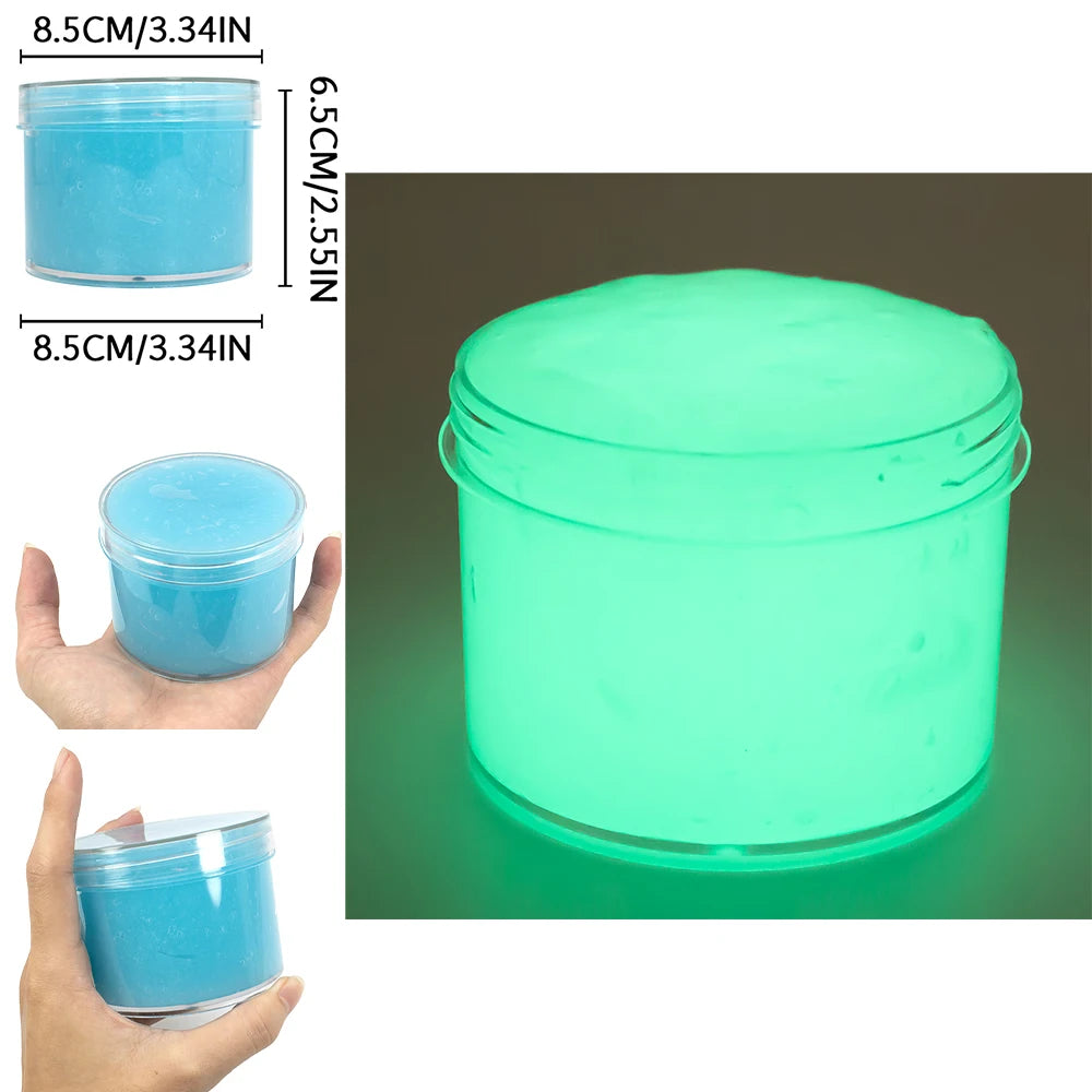 A clear jar of glow-in-the-dark crystal slime with a bright cyan glow, shown next to a hand for scale.