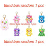A collection of blind box random plush keychain charms featuring various cute animal characters and colors.