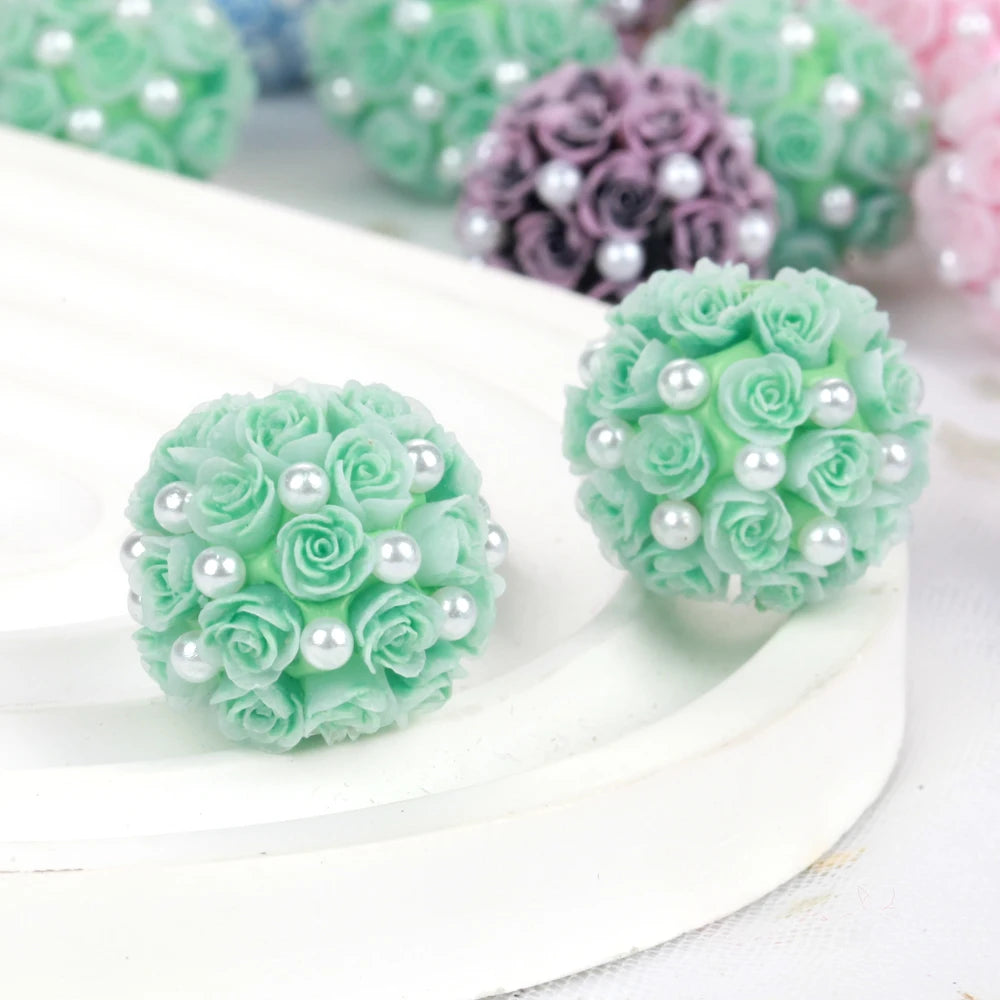A close-up of light green rose flower balls made of acrylic beads for jewelry making