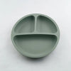 Ensemble d'alimentation en silicone rond vert clair avec trois compartiments pour tout-petits.