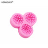 Pink silicone mold shaped like a peony or rose flower for resin, jewelry, and baking.