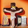 A plush doll set featuring a Jesus cross figure and a Holy Bible book displayed against an orange background.