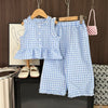Girls' blue and white checkered lace vest and wide-leg pants set displayed on a wooden hanger.