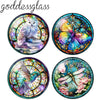 A set of ten round glass cabochons featuring nature scenes like owls, butterflies, and flowers for jewelry making.