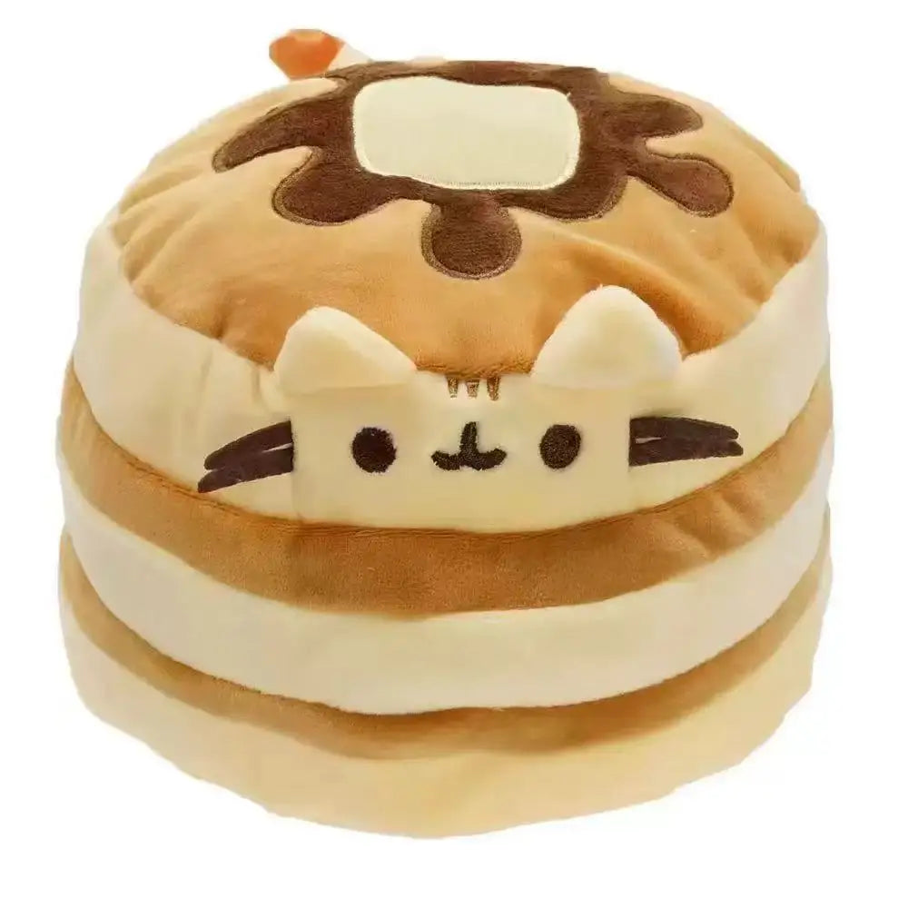 A soft, brown and cream plush cat toy with a face design and dripping icing detail.