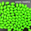 A pile of bright green luminous fishing beads, oval-shaped and numerous, are displayed on a dark surface.