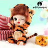 An orange and black striped tiger plush doll with soft features is shown against a light background.