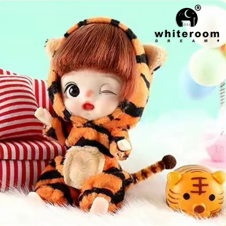An orange and black striped tiger plush doll with soft features is shown against a light background.