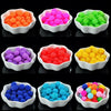 A collection of brightly colored acrylic pearl beads in various shades including orange, pink, purple, green, yellow, and blu