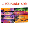 Three packs of random style spooky Halloween squishy stress toys in orange, green, and purple packaging