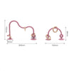 Pink silicone teether ring shaped like a curved hook for baby teethers