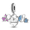 A silver heart charm bead with pink zircon stones and a letter B charm.