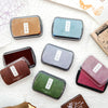 A collection of vintage craft oil-based ink pads in various colors including brown, blue, purple, green, and rose dust on a w