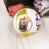 A close-up of a Zuru Mini Brands Create Masterpieces series blind ball with a framed portrait design.