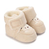 Pair of beige baby winter cartoon boots with soft lining and non-slip sole