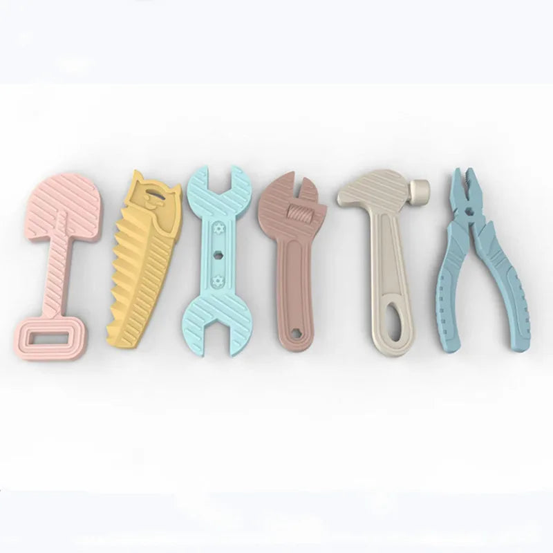A set of silicone baby teether toys shaped like various tools, including a hammer, pliers, and a screwdriver.