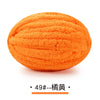 A ball of bright orange chunky chenille yarn for hand knitting projects.