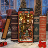 A set of wooden book spines and a miniature Christmas street corner model kit for a DIY wooden book nook.