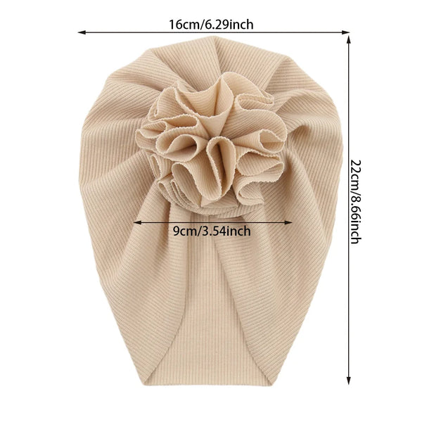 Beige handgefertigtes Baumwoll-Rüschen-Baby-Tuch mit geripptem Blütenmuster.