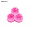 Pink silicone mold shaped like a peony or rose flower, used for resin casting and jewelry making.