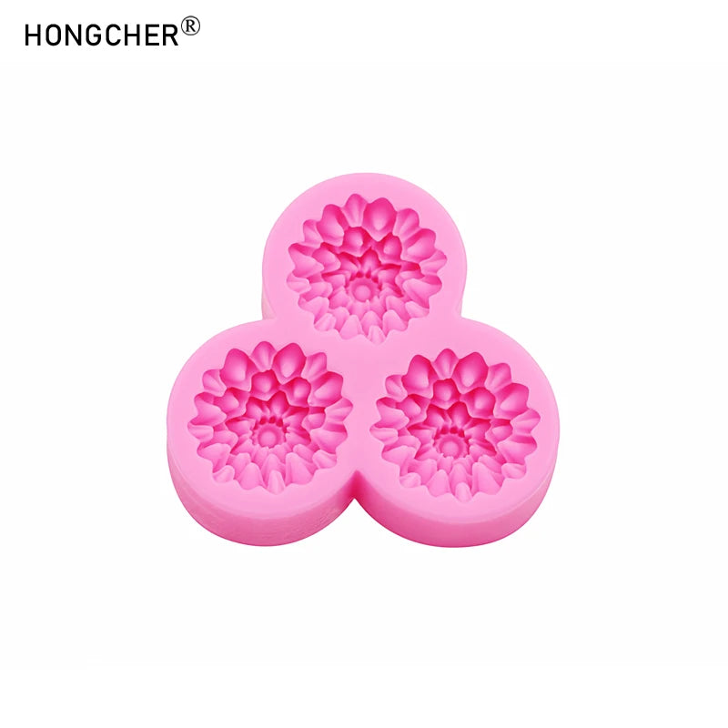 Pink silicone mold shaped like a peony or rose flower, used for resin casting and jewelry making.