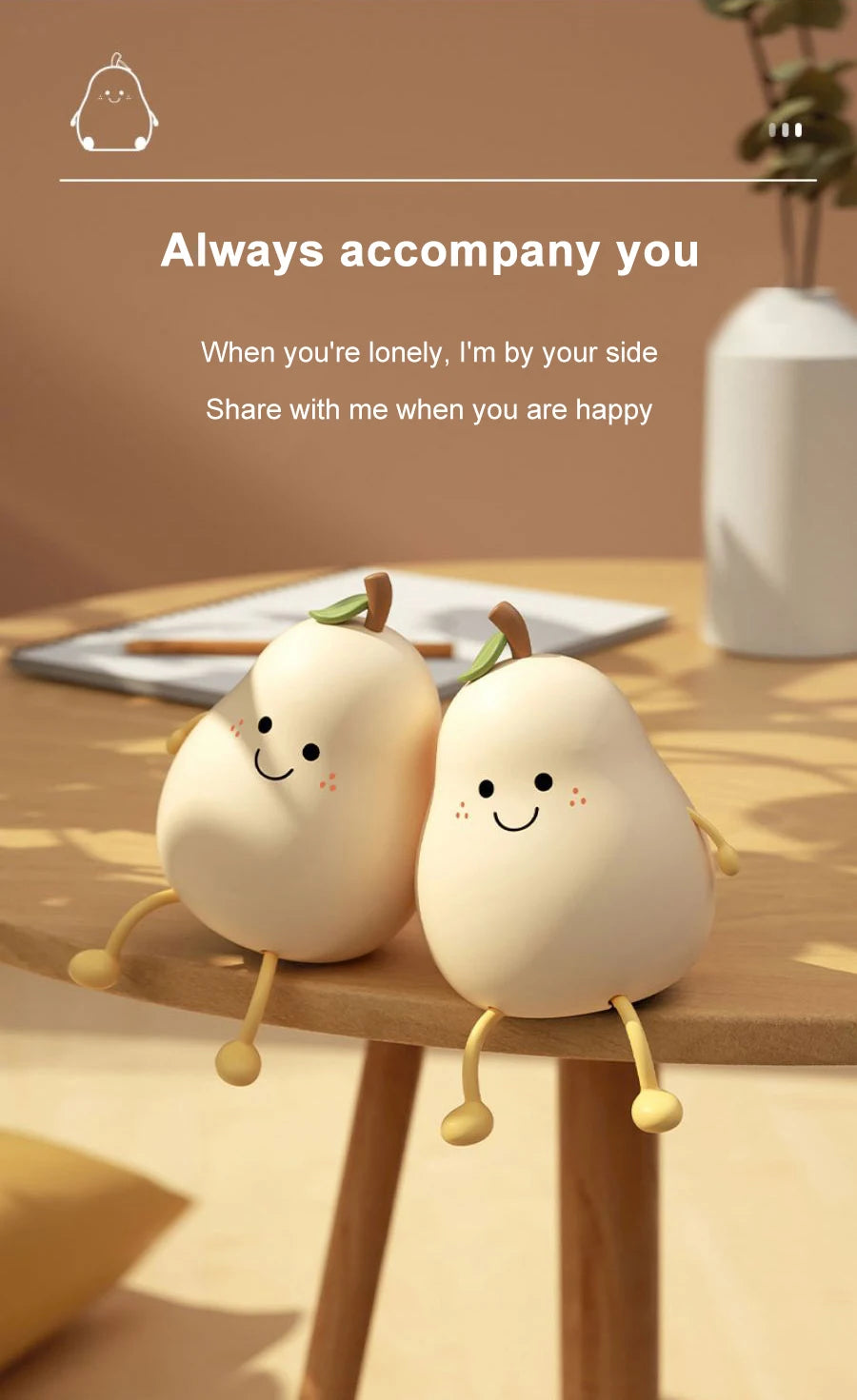 Two adorable pear-shaped night lights sitting on a wooden table with soft lighting.