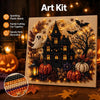 An art kit featuring a detailed Halloween ghost house painted with sparkling plastic beads and glitter.