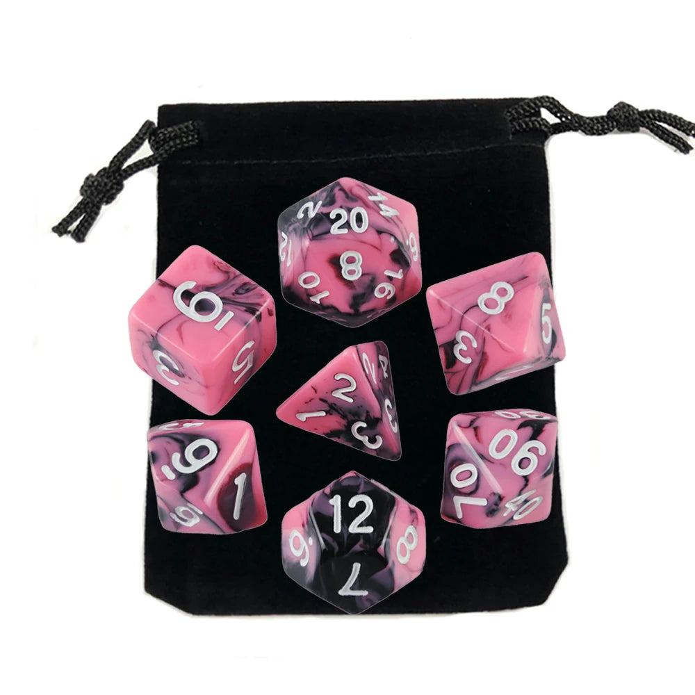 A set of pink and black marbled polyhedral dice stored in a black fabric bag.