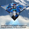 A futuristic, blue and gray stunt glider with LED lights is shown flying against a cloudy sky.