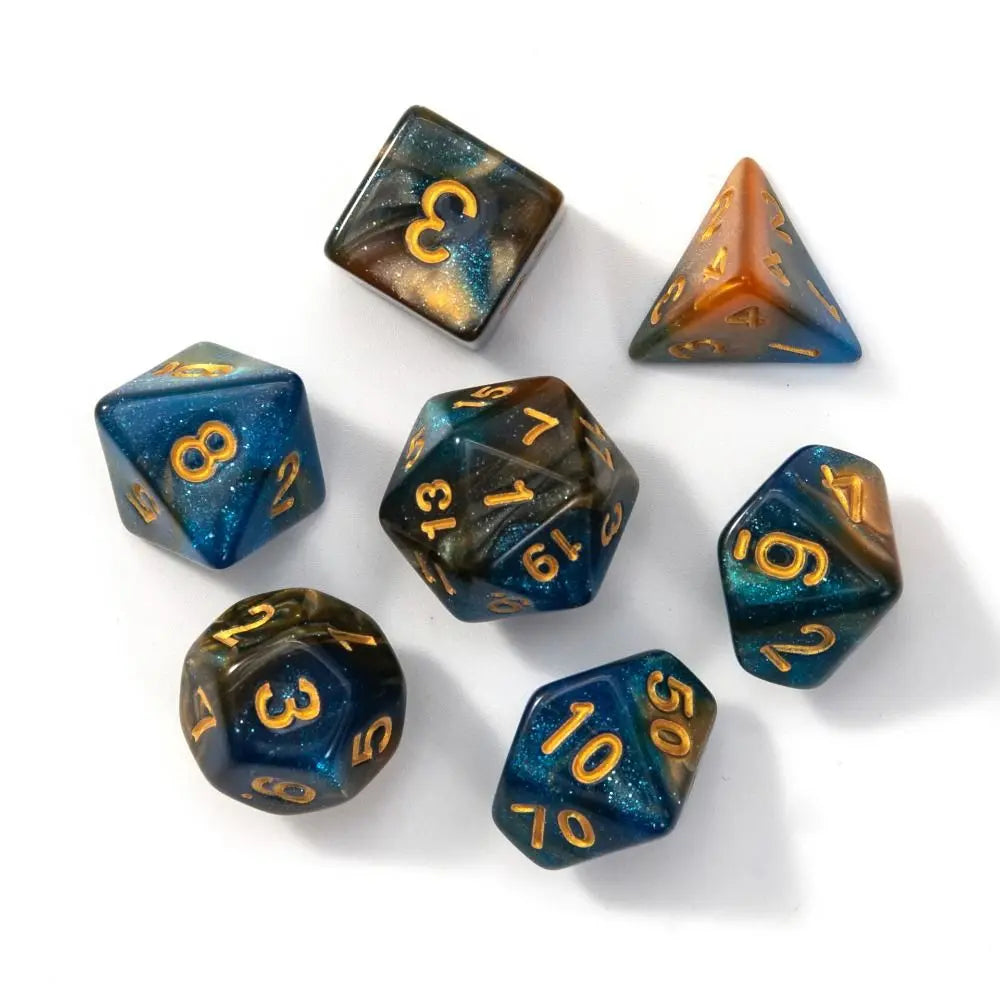 A collection of seven polyhedral acrylic dice in various colors and shapes scattered on a white surface.