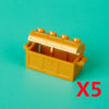 A yellow building block treasure chest set with an open lid and coins, displayed on a teal background.