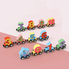 A set of magnetic wooden number train cars showing numbers 7, 8, 9, 10, 3, 4, 5, 6, and 1, arranged in a line.