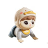 A cute, light-colored baby doll with a hood and yellow accents is shown in a close-up view.