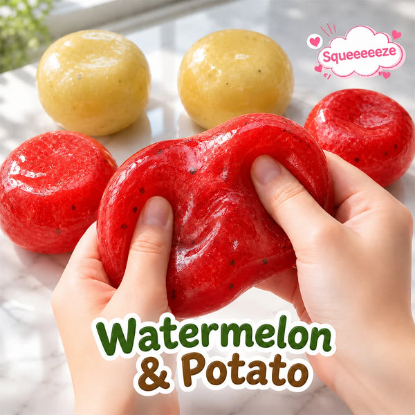 Hands hold a bright red watermelon and potato squishy stress relief toy next to yellow versions.