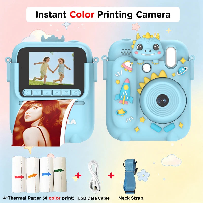 A blue instant color printing camera with a dinosaur theme, showing various accessories like thermal paper and a neck strap.